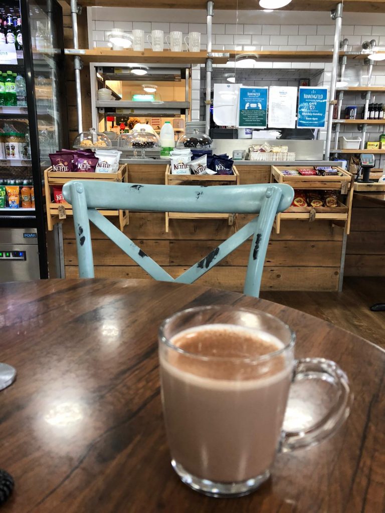A photo of a hot chocolate sat om a table in the Cafe by the water in Hanningfield Waterside Park