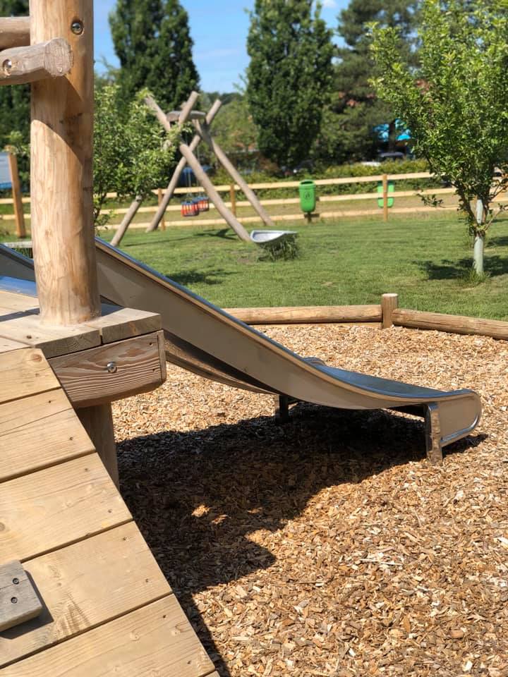 The playpark at Hanningfield Waterside Park. Photo of a metal slide attached to a wooden play frame